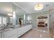 Luxurious bathroom with double vanity, granite countertops, and a large mirror at 1001 Welch Ln, Raleigh, NC 27614