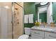Modern bathroom with glass shower, granite countertops, and stylish fixtures at 1001 Welch Ln, Raleigh, NC 27614