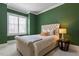 Cozy bedroom features a neutral color palette, tufted headboard, and bright natural light at 1001 Welch Ln, Raleigh, NC 27614