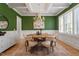 Elegant dining room with wainscoting, hardwood floors, and a stylish chandelier at 1001 Welch Ln, Raleigh, NC 27614