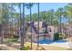 Charming two-story brick home featuring an attached two-car garage and a well-manicured lawn at 1001 Welch Ln, Raleigh, NC 27614