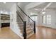 Grand foyer with hardwood floors, staircase, and a view of the front doors at 1001 Welch Ln, Raleigh, NC 27614