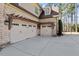 Three-car garage with pergola and basketball court at 1001 Welch Ln, Raleigh, NC 27614
