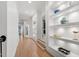Bright hallway with hardwood floors, recessed lighting, and decorative built-in shelves at 1001 Welch Ln, Raleigh, NC 27614