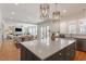 Open-concept kitchen with a large island, connecting to the living and dining areas for seamless entertaining at 1001 Welch Ln, Raleigh, NC 27614