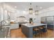 Gourmet kitchen featuring a central island, stainless steel appliances, and custom cabinets with ample counter space at 1001 Welch Ln, Raleigh, NC 27614