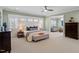 Serene main bedroom with sitting area, plantation shutters, and soft lighting at 1001 Welch Ln, Raleigh, NC 27614