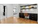 Home office with built-in desk, shelving, and view of the bedroom at 1001 Welch Ln, Raleigh, NC 27614