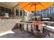 Outdoor kitchen with stainless steel grill, granite countertops, and ample storage space at 1001 Welch Ln, Raleigh, NC 27614