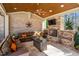 Inviting outdoor area with comfortable seating, a fireplace, and a mounted TV at 1001 Welch Ln, Raleigh, NC 27614