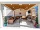 Covered outdoor living area with comfortable seating, a fireplace, and a ceiling fan at 1001 Welch Ln, Raleigh, NC 27614