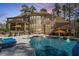 Beautiful pool area complete with a built-in bar, covered patio, and ample seating at 1001 Welch Ln, Raleigh, NC 27614