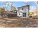 Exterior view of the house with a large deck, patio and spacious backyard at 1004 Helms Pl, Raleigh, NC 27610