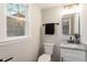 Modern powder room featuring granite countertop, undermount sink and brushed nickel faucet at 1004 Helms Pl, Raleigh, NC 27610