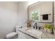Modern bathroom with granite countertops, vanity and stylish mirror at 1004 Helms Pl, Raleigh, NC 27610