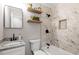 Beautiful bathroom featuring marble tile shower and floating shelves with modern fixtures at 1004 Helms Pl, Raleigh, NC 27610