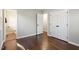 Cozy bedroom with hardwood floors, closet and entrance to the bathroom at 1004 Helms Pl, Raleigh, NC 27610
