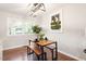 Bright dining area featuring wood floors, modern lighting, and a stylish table with bench seating at 1004 Helms Pl, Raleigh, NC 27610