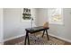 Home office featuring hardwood floors, stylish desk, lamp, and modern décor at 1004 Helms Pl, Raleigh, NC 27610