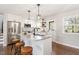 Contemporary kitchen equipped with stainless steel appliances, granite countertops, and stylish barstool seating at 1004 Helms Pl, Raleigh, NC 27610