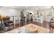 Inviting living space features a modern open layout with bar stool seating, with stairs leading to the next level at 1004 Helms Pl, Raleigh, NC 27610