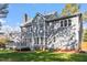 Features a backyard with deck, mature trees, and well-maintained lawn at 101 Weatherly Pl, Cary, NC 27518