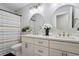 Elegant bathroom featuring a double vanity, round mirrors, and modern fixtures at 101 Weatherly Pl, Cary, NC 27518