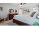 Comfortable bedroom featuring a ceiling fan, neutral colors, and elegant furnishings at 101 Weatherly Pl, Cary, NC 27518