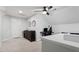 Bonus room offering versatile space with neutral colors and a ceiling fan at 101 Weatherly Pl, Cary, NC 27518