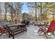 Outdoor deck featuring a dining table, chairs, and a comfortable lounge area with grill at 101 Weatherly Pl, Cary, NC 27518