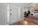 Bright entryway featuring a white front door and views to the living area and office space at 101 Weatherly Pl, Cary, NC 27518