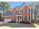 Charming two-story brick home with a well-manicured front yard at 101 Weatherly Pl, Cary, NC 27518