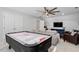 Spacious game room with an air hockey table, sofas, and a ceiling fan at 101 Weatherly Pl, Cary, NC 27518