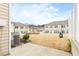 View of the community green space and townhome exteriors from the back patio at 1019 Navigon Dr, Durham, NC 27713