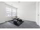 Simple room with exercise equipment including bench and weights near a sunny window at 1019 Navigon Dr, Durham, NC 27713