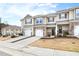 Inviting townhome with stone accents, attached garages, well-kept lawns, and beautiful architectural details at 1019 Navigon Dr, Durham, NC 27713