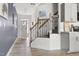 Welcoming foyer with staircase, neutral paint, and attractive flooring, offering a grand entrance at 1019 Navigon Dr, Durham, NC 27713
