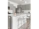 Beautiful kitchen island featuring light countertop, seating, and stainless steel appliances at 1019 Navigon Dr, Durham, NC 27713