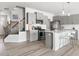 Modern kitchen featuring stainless steel appliances, a center island, and stylish gray cabinets at 1019 Navigon Dr, Durham, NC 27713