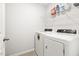Compact laundry area with side-by-side washer and dryer at 1019 Navigon Dr, Durham, NC 27713