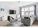 Bright living room features modern furnishings, large windows, and stylish decor accents at 1019 Navigon Dr, Durham, NC 27713