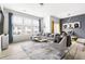 Inviting living room with large windows, comfortable seating, and a stylish accent wall at 1019 Navigon Dr, Durham, NC 27713