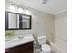 Standard bathroom with a vanity, framed mirrors, and a bathtub at 103 Willoughby Ln, Cary, NC 27513