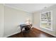 Small bedroom with a vintage desk, hardwood floors, and a window at 103 Willoughby Ln, Cary, NC 27513