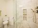 Modern bathroom featuring a tiled shower with glass door and convenient built-in storage niches at 104 Manchester Pl, Chapel Hill, NC 27516