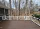 Elevated deck overlooking a serene, wooded backyard with mature trees at 104 Manchester Pl, Chapel Hill, NC 27516