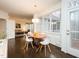 Sunlit dining area with modern chairs and table, adjacent to a cozy living room at 104 Manchester Pl, Chapel Hill, NC 27516