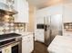 Well-equipped kitchen featuring stainless steel appliances, plenty of storage, and granite countertops at 104 Manchester Pl, Chapel Hill, NC 27516