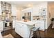 Elegant kitchen featuring a center island, stainless appliances, and patterned backsplash at 104 Manchester Pl, Chapel Hill, NC 27516