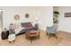 Inviting living room featuring a comfortable sofa, stylish decor, and natural light from a sliding door at 104 Manchester Pl, Chapel Hill, NC 27516